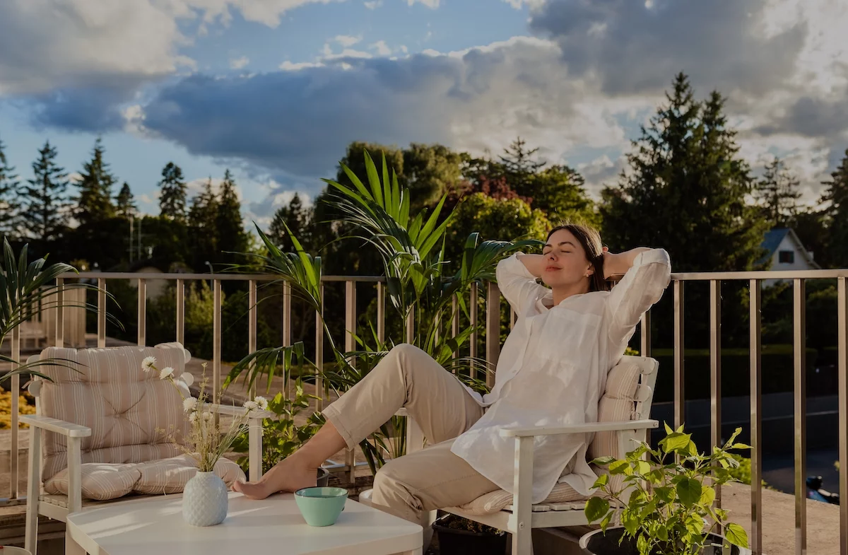 woman relaxing on a balcony